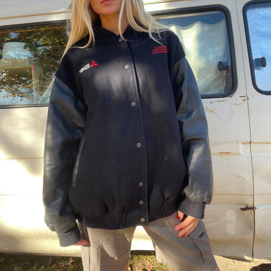 Black and grey Mitsubishi varsity work jacket