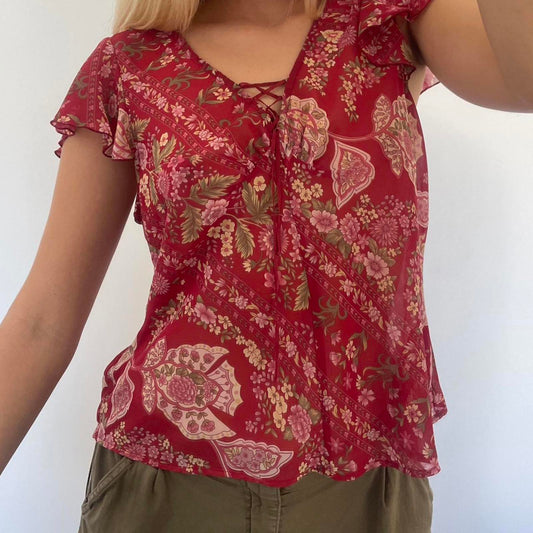 Cute red floral blouse with ruffle sleeves and tie front