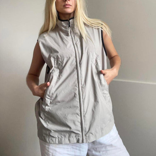 Tan and black zip-up vest with pockets