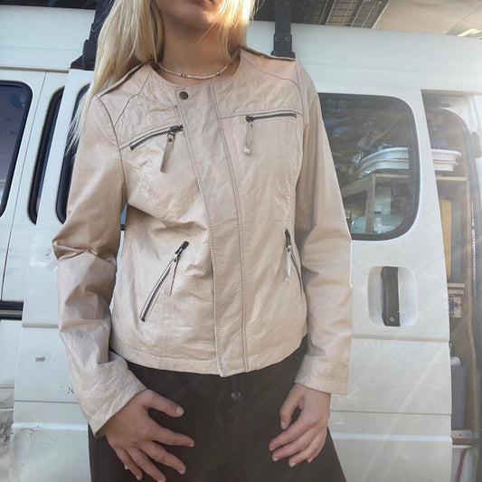 Cream genuine leather jacket with zipper detailing, featuring a cropped fit
