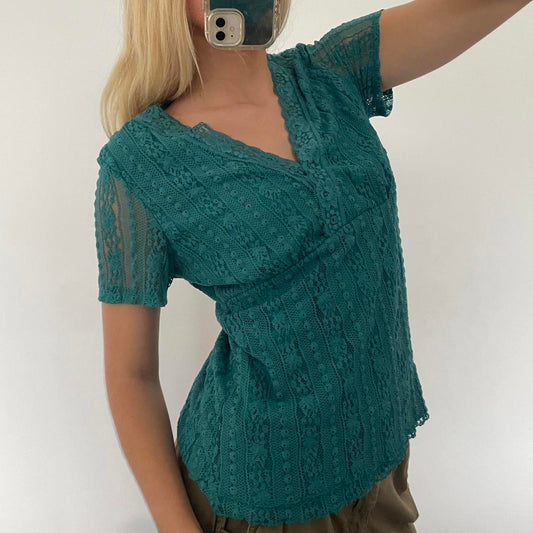 Green lace top with a V-neckline and short sleeves, featuring a lightweight and flowy design. #fairycore #cottagecore