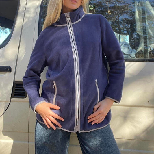 Navy blue fleece jacket with white trim, full zip and pockets